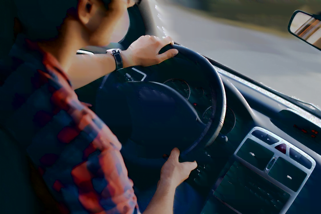 a man driving a car