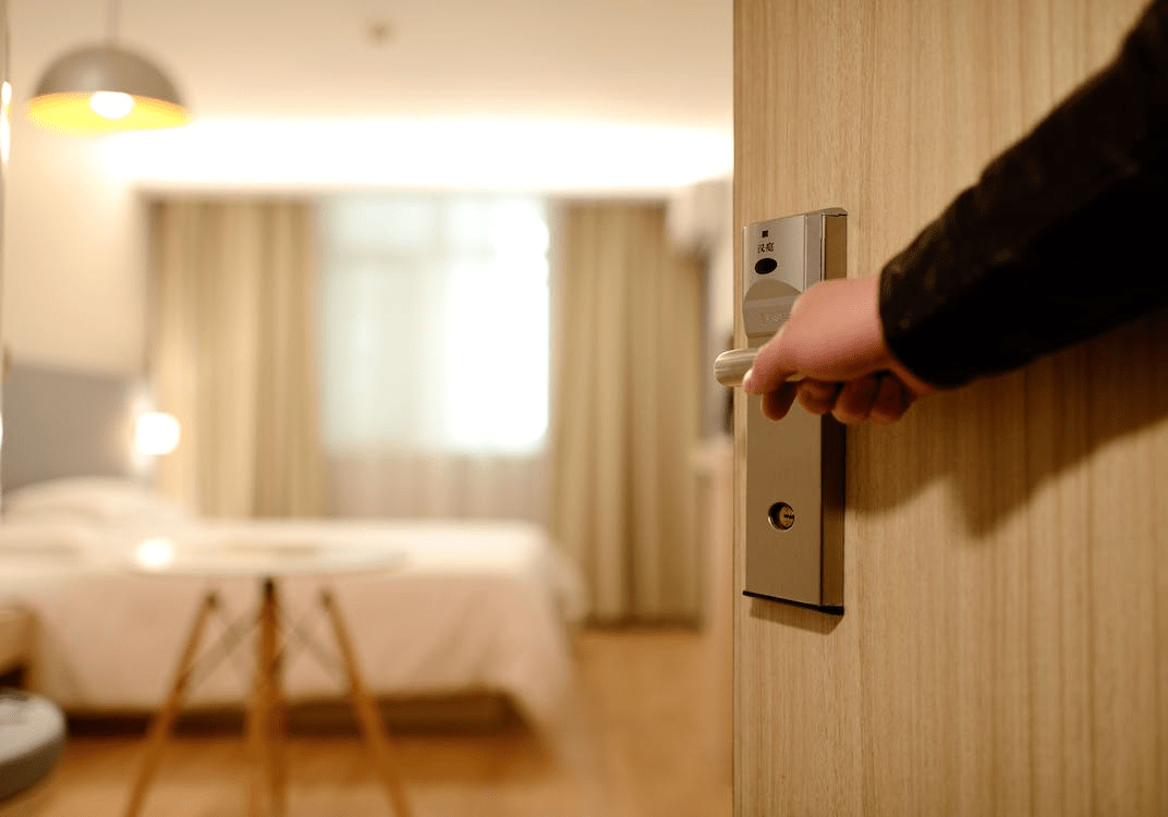 residential locksmith checking the new lock after installing it