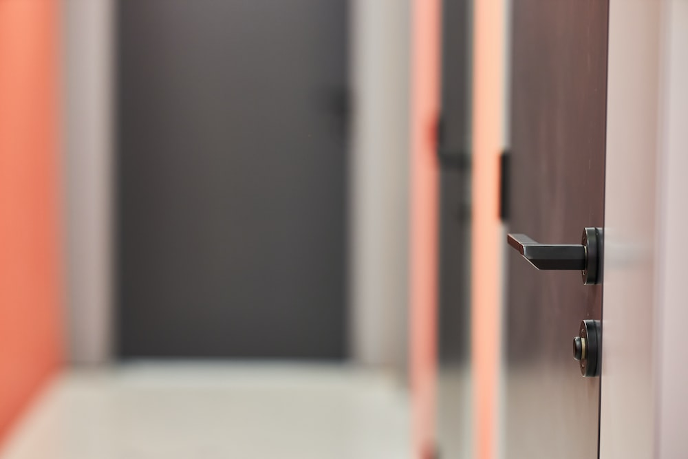 a black door handle on an office door