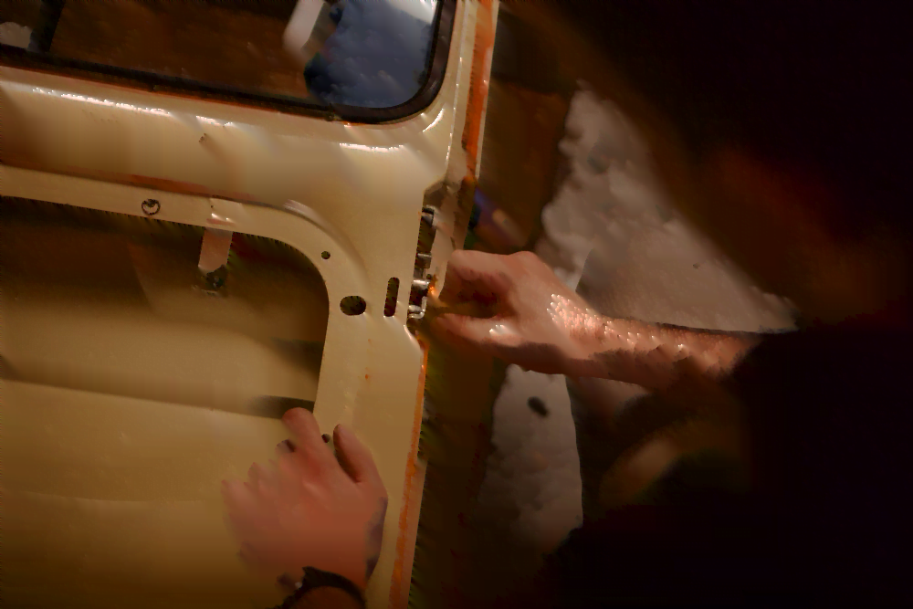 automotive locksmith repairing a vintage car door lock
